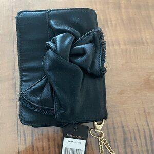 BCBGMAXAZRIA black satin wristlet with large bow and a gold-tone chain NWT